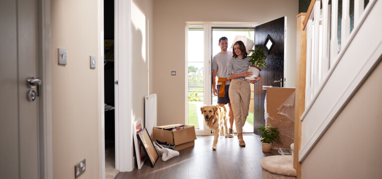 A family walking into their new home