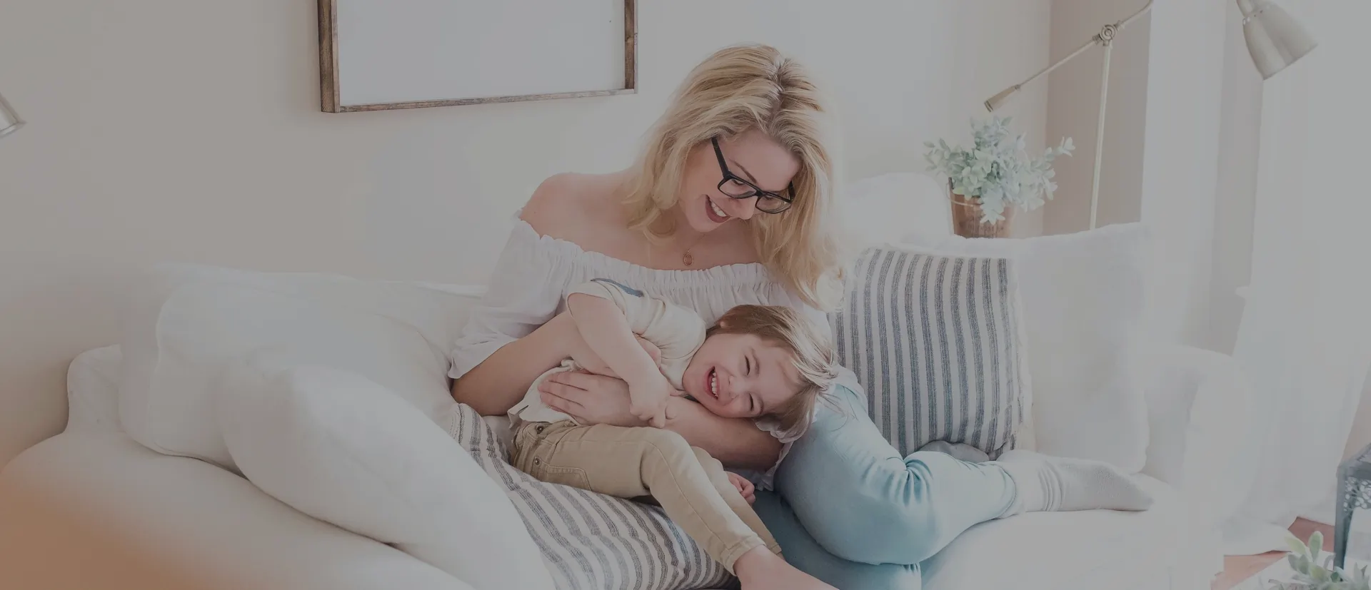 Mother and child playing on couch