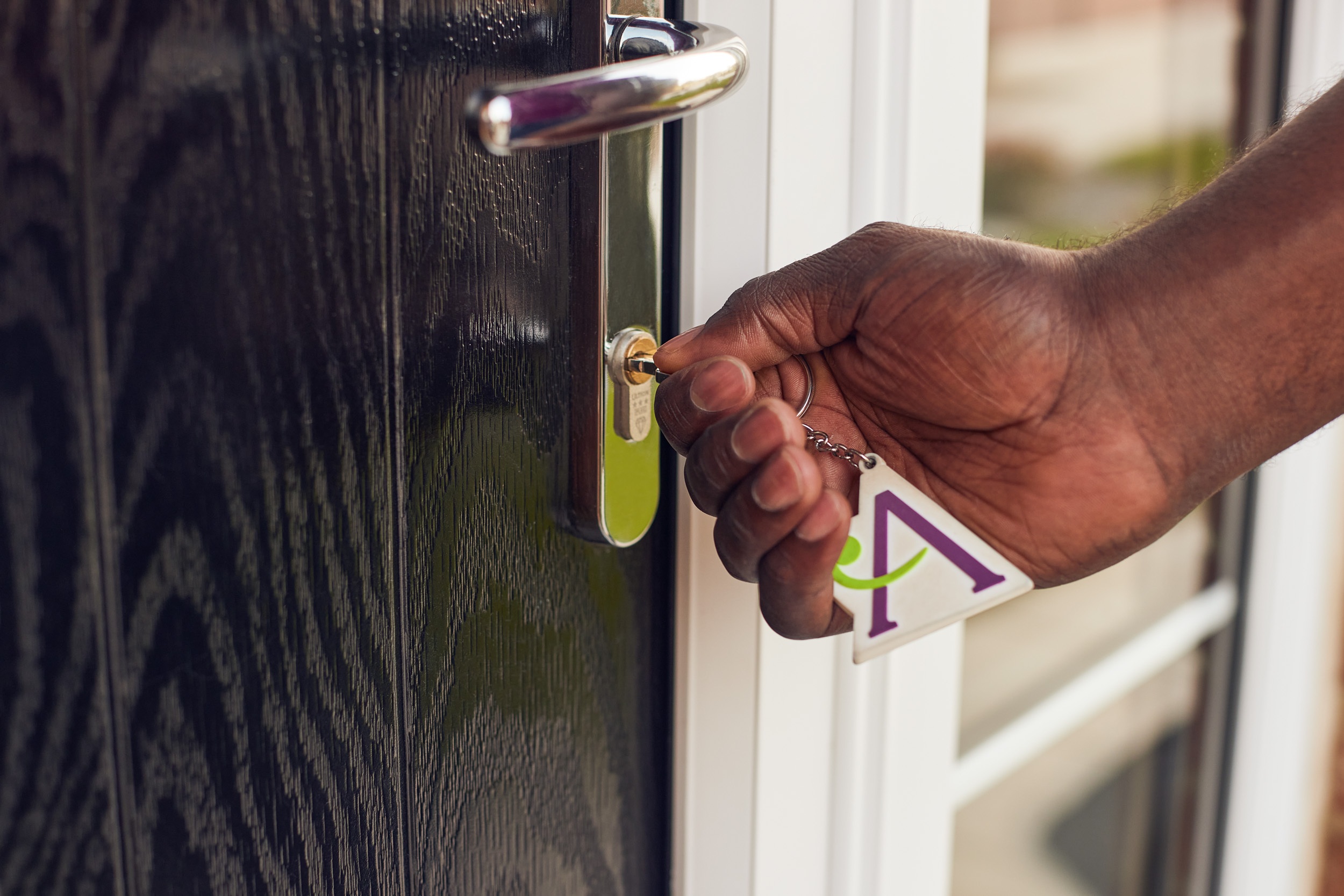 Close-up of Ashberry homeowner entering home